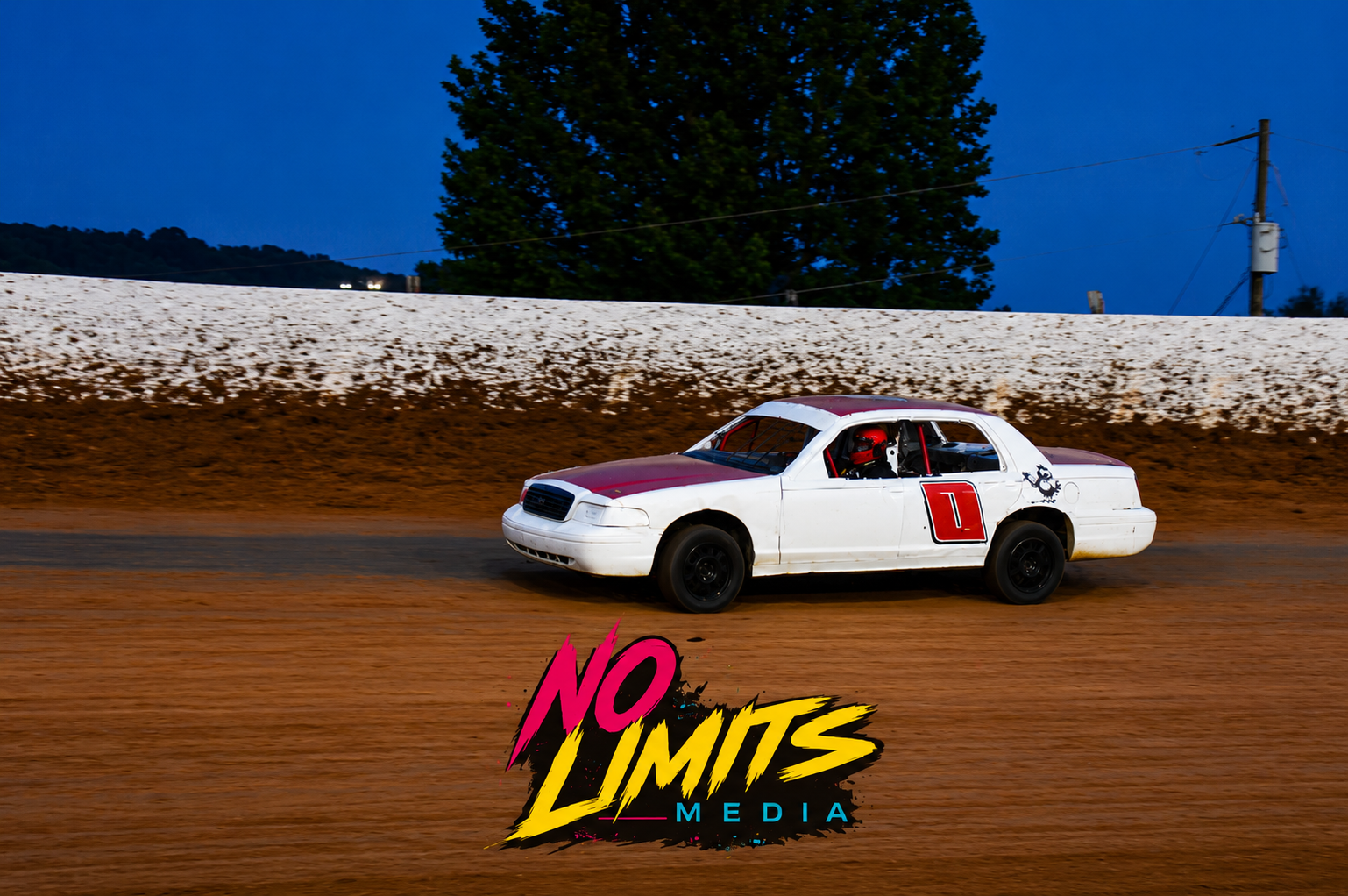 Shawn Lile's white #0 Crown Vic on the dirt track